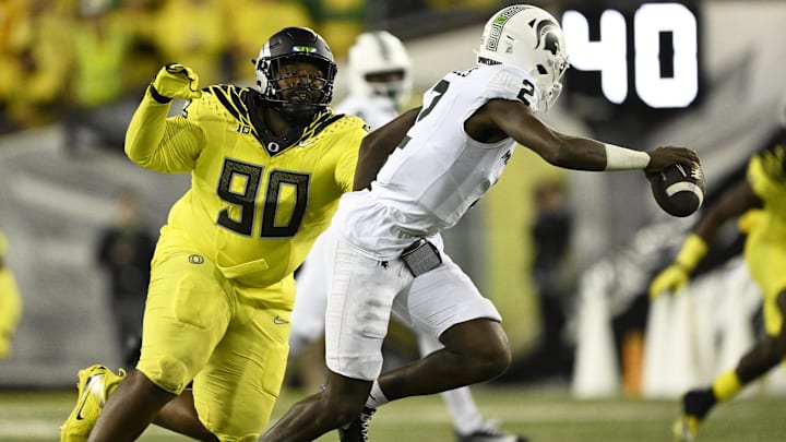 Oct 4, 2024; Eugene, Oregon, USA; Oregon Ducks defensive lineman Jamaree Caldwell (90) chases after Michigan State Spartans quarterback Aidan Chiles (2) during the second half at Autzen Stadium. 