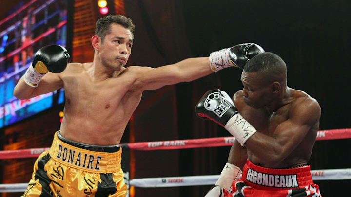 Apr 13, 2013; New York, NY, USA; Nonito Donaire (left) and Guillermo Rigondeaux (right) trade punches during their 12 round WBO/WBA Super Bantamweight title fight at Radio City Music Hall.  Mandatory Credit: Ed Mulholland-Imagn Images