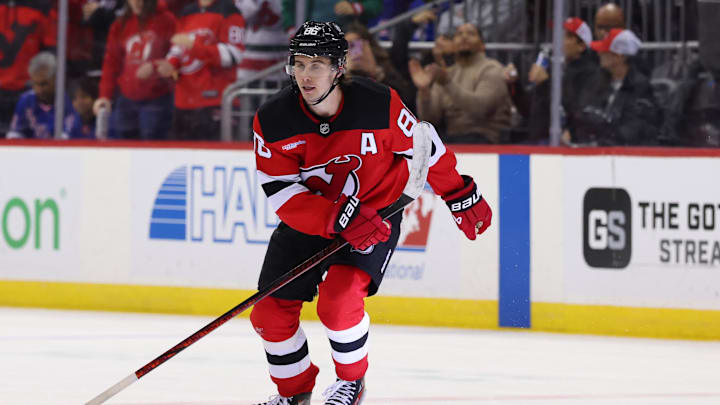 Dec 23, 2024; Newark, New Jersey, USA; New Jersey Devils center Jack Hughes (86) celebrates his goal against the New York Rangers during the second period at Prudential Center. Mandatory Credit: Ed Mulholland-Imagn Images