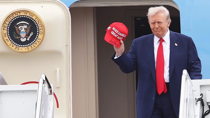 President Donald Trump disembarks from Air Force One at Daytona International Airport Sunday, Feb. 16, 2025, before getting into his motorcade and heading to the Daytona International Speedway for the Daytona 500.