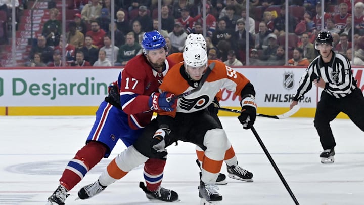 Sep 23, 2024; Montreal, Quebec, CAN; Montreal Canadiens forward Josh Anderson (17) checks Philadelphia Flyers defenseman Oliver Bonk (59) during the third period at the Bell Centre. Mandatory Credit: Eric Bolte-Imagn Images