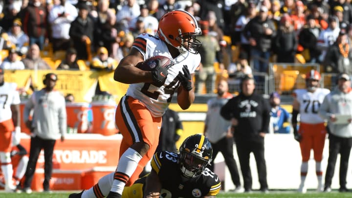 Jan 8, 2023; Pittsburgh, Pennsylvania, USA;  Cleveland Browns running back Nick Chubb (24) runs past  Pittsburgh Steelers at linebacker Mark Robinson (93) during the first quarter Acrisure Stadium. Mandatory Credit: Philip G. Pavely-USA TODAY Sports