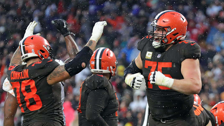 Browns guard Joel Bitonio (75) and tackle Jack Conklin (78) celebrate after Nick Chubb scored the game-winning touchdown in overtime against the Buccaneers, Sunday, Nov. 27, 2022, in Cleveland.

Browns27jl 8