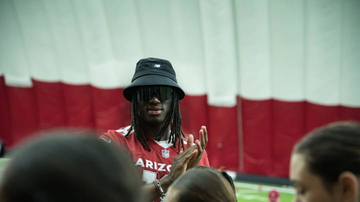 Marvin Harrison Jr. claps for the student athletes during the Cardinals girls flag football clinic at the Cardinals training facility on June 1, 2024 in Tempe, Ariz. Marvin Harrison Jr. claps for the student athletes during the Cardinals girls flag football clinic at the Cardinals training facility on June 1, 2024 in Tempe, Ariz.