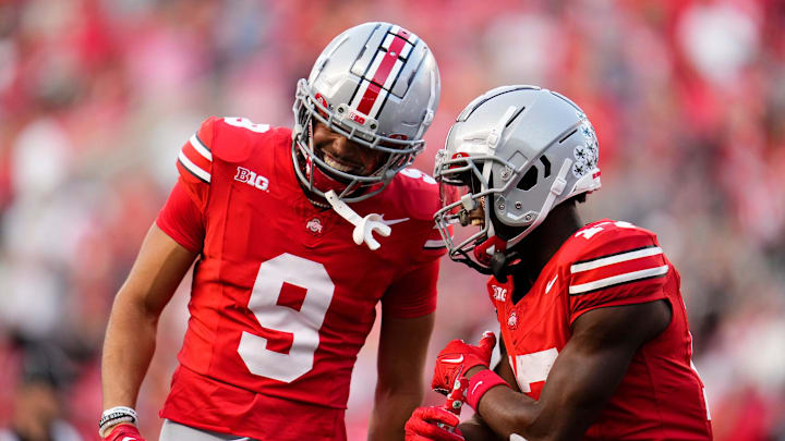 Sep 16, 2023; Columbus, Ohio, USA; Ohio State Buckeyes wide receiver Carnell Tate (17) celebrates a touchdown with wide receiver Jayden Ballard (9) during the second half of the NCAA football game against the Western Kentucky Hilltoppers at Ohio Stadium. Ohio State won 63-10. Sep 16, 2023; Columbus, Ohio, USA; Ohio State Buckeyes wide receiver Carnell Tate (17) celebrates a touchdown with wide receiver Jayden Ballard (9) during the second half of the NCAA football game against the Western Kentucky Hilltoppers at Ohio Stadium. Ohio State won 63-10.