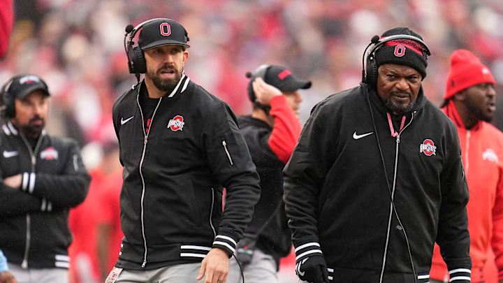 Ohio State Buckeyes assistant coaches James Laurinaitis, left, and Larry Johnson watch from the sideline during the NCAA football game against the Indiana Hoosiers at Ohio Stadium in Columbus on Monday, Nov. 25, 2024. Ohio State won 38-15.