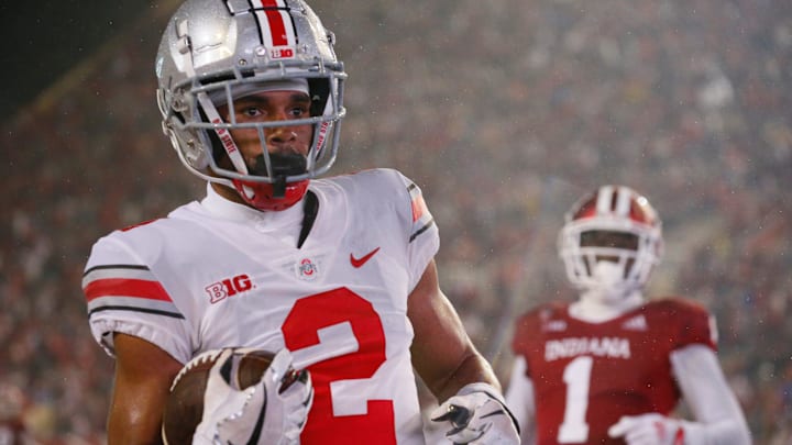 Ohio State Buckeyes wide receiver Chris Olave (2) scores a touchdown past Indiana Hoosiers defensive back Devon Matthews (1) during the NCAA football game at Memorial Stadium in Bloomington, Ind. on Sunday, Oct. 24, 2021. Ohio State won 54-7.

Ohio State Buckeyes At Indiana Hoosiers