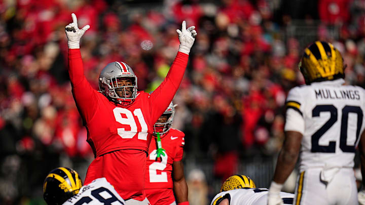 Ohio State Buckeyes defensive tackle Tyleik Williams (91) motions at the line during the first half of the NCAA football game against the Michigan Wolverines at Ohio Stadium in Columbus on Saturday, Nov. 30, 2024.