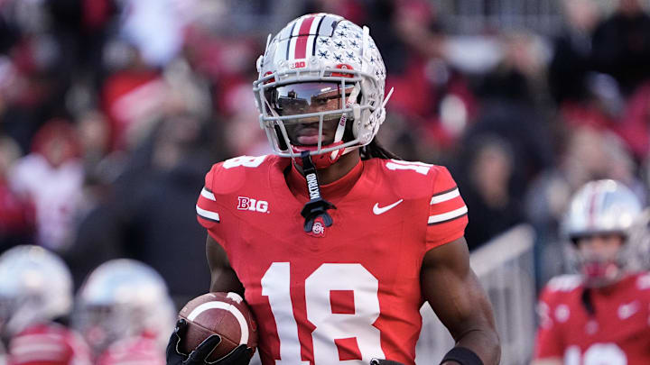 Nov 18, 2023; Columbus, Ohio, USA; Ohio State Buckeyes wide receiver Marvin Harrison Jr. (18) warms up prior to the NCAA football game against the Minnesota Golden Gophers at Ohio Stadium. Nov 18, 2023; Columbus, Ohio, USA; Ohio State Buckeyes wide receiver Marvin Harrison Jr. (18) warms up prior to the NCAA football game against the Minnesota Golden Gophers at Ohio Stadium.