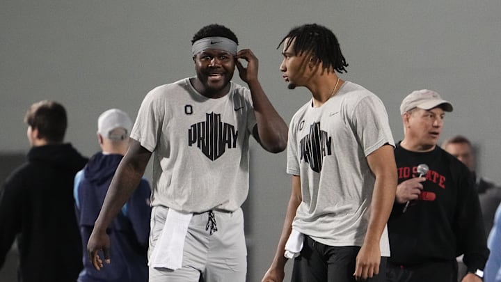 Mar 23, 2022; Columbus, Ohio, USA; Ohio State Buckeyes quarterback C.J. Stroud talks to former quarterback Cardale Jones during the football pro day at the Woody Hayes Athletic Center in Columbus, Ohio. Mandatory Credit: Adam Cairns-Imagn Images