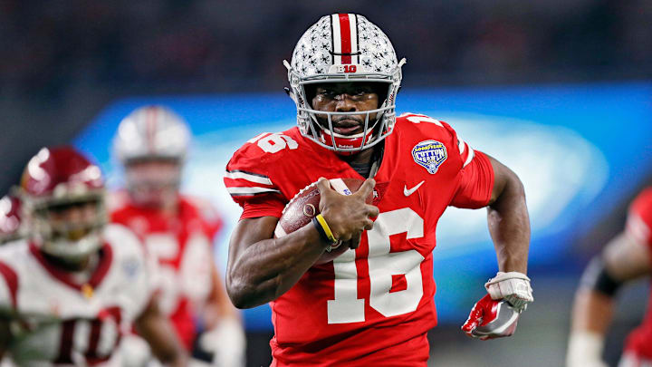 Ohio State Buckeyes quarterback J.T. Barrett (16) scores on a running touchdown against USC Trojans in the 1st half at the 82nd Goodyear Cotton Bowl Classic at AT&T Stadium in Arlington, Texas on December 29, 2017. [Kyle Robertson/Dispatch]