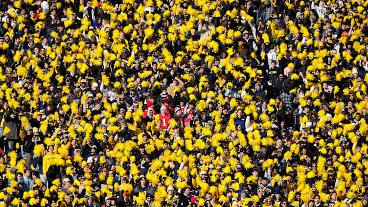 Nov 25, 2023; Ann Arbor, Michigan, USA; A small group of Ohio State Buckeyes fans stand among the Michigan Wolverines students during the first half of the NCAA football game at Michigan Stadium. Nov 25, 2023; Ann Arbor, Michigan, USA; A small group of Ohio State Buckeyes fans stand among the Michigan Wolverines students during the first half of the NCAA football game at Michigan Stadium.