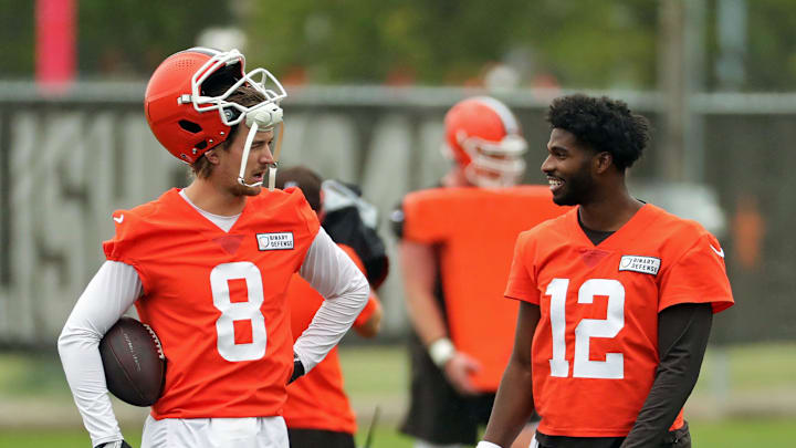 Cleveland Browns quarterback Kenny Pickett, left, chats with quarterback Shedeur Sanders (12) during an NFL practice at the Cleveland Browns training facility on Wednesday, May 28, 2025, in Berea, Ohio.