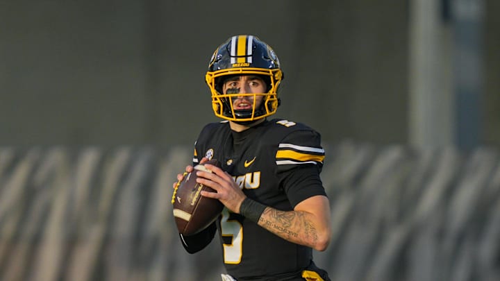 Nov 8, 2025; Columbia, Missouri, USA; Missouri Tigers quarterback Matt Zollers (5) drops back to pass during the first half against the Texas A&M Aggies at Faurot Field at Memorial Stadium. Mandatory Credit: Jay Biggerstaff-Imagn Images Nov 8, 2025; Columbia, Missouri, USA; Missouri Tigers quarterback Matt Zollers (5) drops back to pass during the first half against the Texas A&M Aggies at Faurot Field at Memorial Stadium. Mandatory Credit: Jay Biggerstaff-Imagn Images