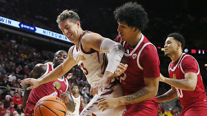 Iowa State cyclones forward Brandton Chatfield (33) and IU Indianapolis Jaguars forward DeSean Goode (2) battle for the loose ball during the second half in the NCAA men’s basketball at Hilton Coliseum on Monday, Nov. 18, 2024, in Ames, Iowa.