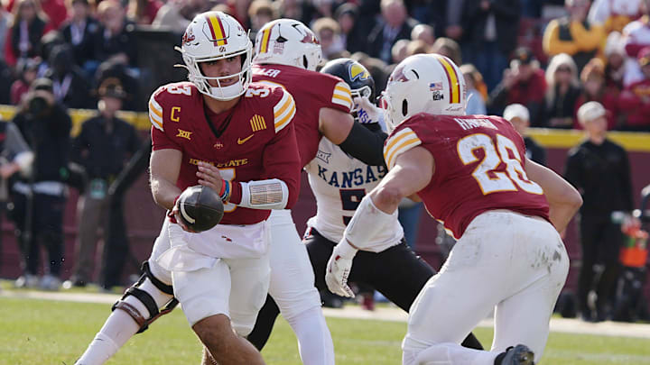 Iowa State Cyclones' quarterback Rocco Becht (3) hands off the ball running back Carson Hansen (26) during the fourth quarter in the senior day on Nov. 22, 2025, at Jack Trice Stadium in Ames, Iowa Iowa State Cyclones' quarterback Rocco Becht (3) hands off the ball running back Carson Hansen (26) during the fourth quarter in the senior day on Nov. 22, 2025, at Jack Trice Stadium in Ames, Iowa