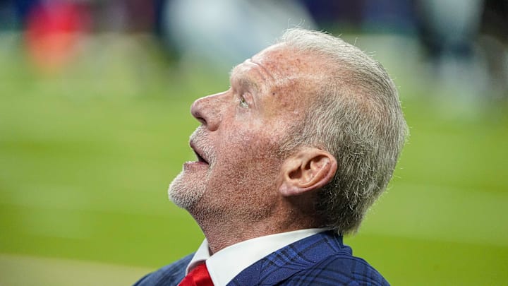 Indianapolis Colts owner Jim Irsay experiences the new field turf and chats with friends.