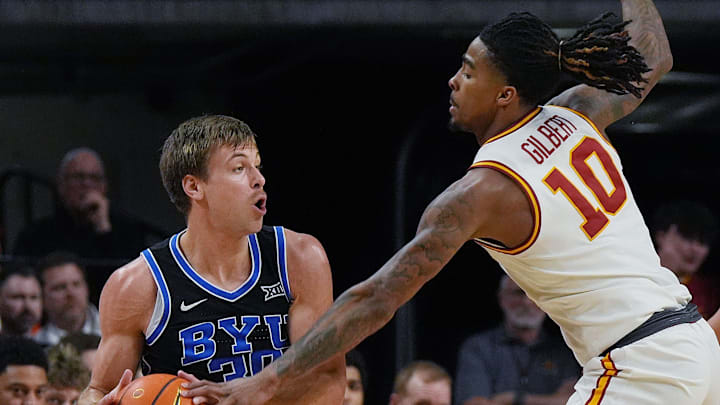 Iowa State Cyclones guard Keshon Gilbert (10) tries to nocks the ball out from BYU Cougars's guard Dallin Hall (30) during the first half of the Big-12 men’s basketball in the Senior Day at Hilton Coliseum on March 4, 2025, in Ames, Iowa.