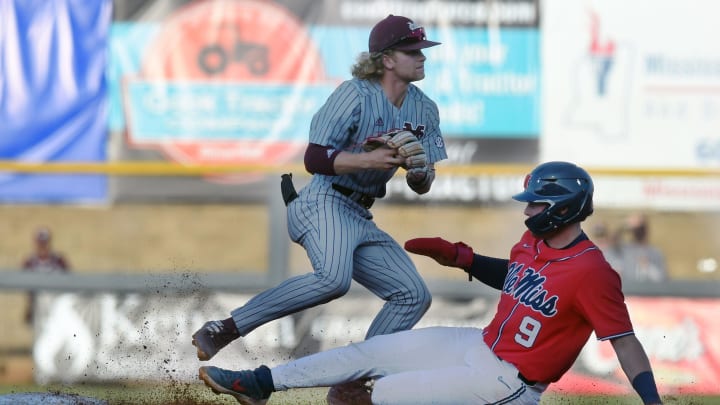 Mississippi State infielder David Mershon (3) gets Ole Miss runner Ethan Lege (9) out at second in the bottom of the second inning during the Governor   s Cup at Trustmark Park in Pearl, Miss., Tuesday, April 25, 2023.

Tcl Ole Miss Vs Msu