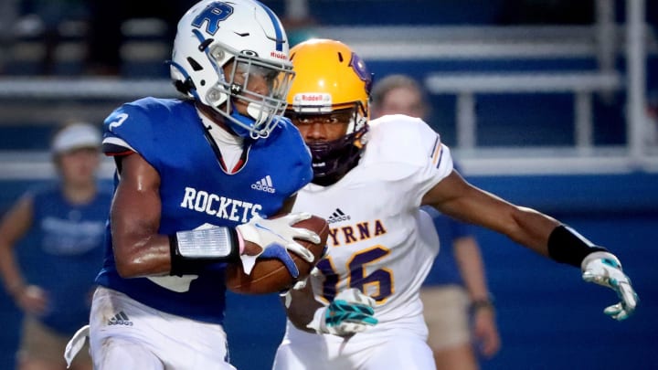 Rockvale's Jaylan Morgan (2) runs the ball as Smyrna's Kylan Andrews (16) moves in for a tackle on Thursday, Aug. 25, 2022, at Rockvale.

33 Rockvale V Smyrna Football