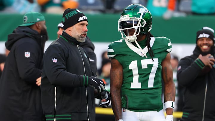 Jan 5, 2025; East Rutherford, New Jersey, USA; New York Jets interim head coach Jeff Ulbrich speaks with wide receiver Davante Adams (17) during pregame warmups for their game against the Miami Dolphins at MetLife Stadium. Mandatory Credit: Ed Mulholland-Imagn Images