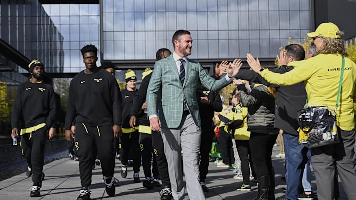 Oct 4, 2024; Eugene, Oregon, USA; Oregon Ducks head coach Dan Lanning high-fives fans before a game against the Michigan State Spartans at Autzen Stadium. Mandatory Credit: Troy Wayrynen-Imagn Images
