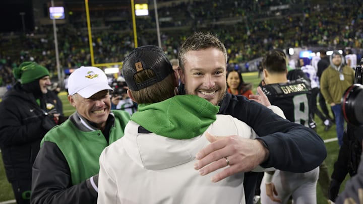 Nov 30, 2024; Eugene, Oregon, USA; Oregon Ducks head coach Dan Lanning celebrates after beating the Washington Huskies at Autzen Stadium. Mandatory Credit: Troy Wayrynen-Imagn Images