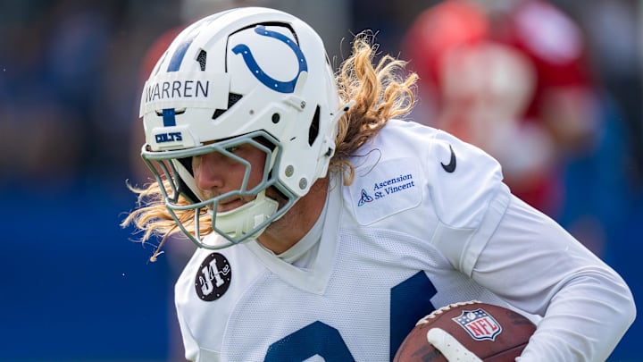 Indianapolis Colts tight end Tyler Warren (84) runs after catching a pass Friday, July 25, 2025, during training camp held at Grand Park in Westfield.