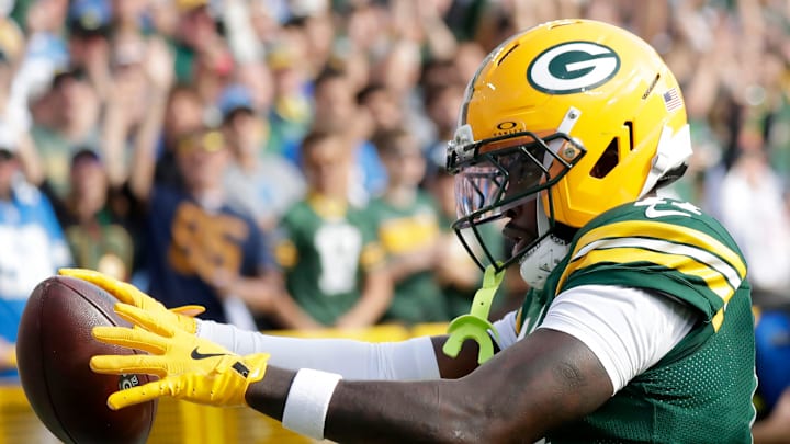 Green Bay Packers wide receiver Jayden Reed (11) catches a second quarter touchdown pass against the Detroit Lions on Sunday, September 7, 2025, at Lambeau Field in Green Bay, Wis.