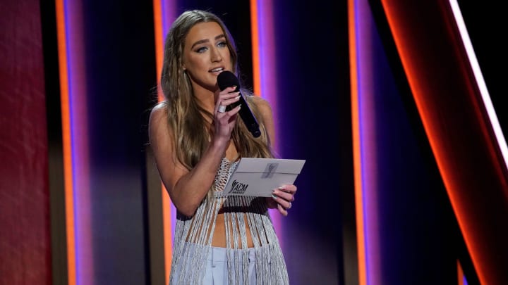 Ingrid Andress presents the award for Male Artist of the Year to Thomas Rhett during the 56th ACM awards in Nashville on Sunday, April 18, 2021.