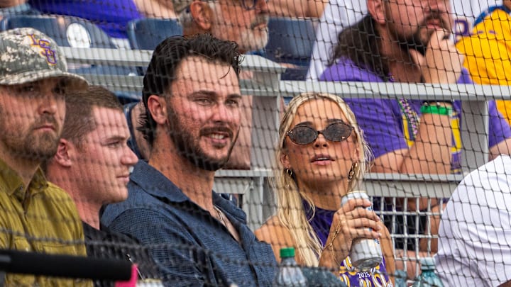 Paul Skenes and Livvy Dunne watch from behind home plate during the first inning between the UCLA Bruins and the LSU Tigers at Charles Schwab Field on June 16.