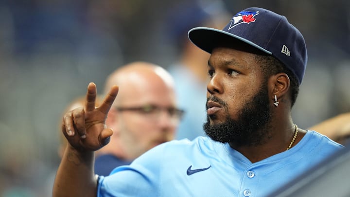 Aug 22, 2025; Miami, Florida, USA; Toronto Blue Jays first baseman Vladimir Guerrero Jr. (27) waives to fans between inning against the Miami Marlins at loanDepot Park. Mandatory Credit: Jim Rassol-Imagn Images