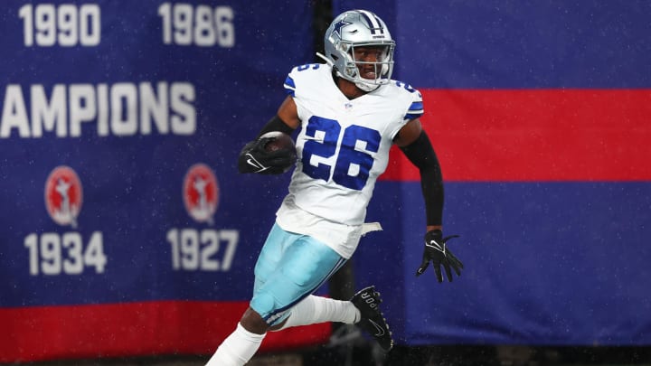 Sep 10, 2023; East Rutherford, New Jersey, USA; Dallas Cowboys cornerback DaRon Bland (26) returns an interception for a touchdown against the New York Giants during the first half at MetLife Stadium.  
