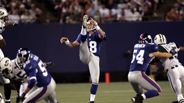Giants punter Jeff Feagles punting against the Jets, at the Meadowlands Aug. 26, 2005..