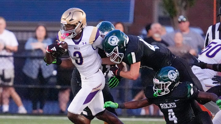 Male’s Antonio Harris gains yardage against Trinity in the first half Friday, Sept. 20, 2024.