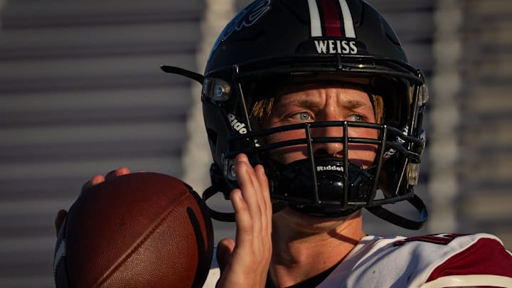 Weiss freshman quarterback Jaxon Schad (15) warms up ahead of the Wolves' game against the San Marcos Rattlers in a Friday night match-up at Rattler Stadium, Sept. 6, 2024.