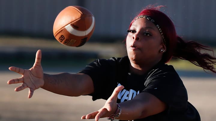 Ja’khiya Stewart catches a pass during the Riverdale girls’ flag football practice on Tuesday, Feb. 25, 2025, at Riverdale, as the team practices running different routes.
