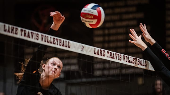 Dripping Springs' Henley Anderson (22) sends a kill attempt over the net while playing in an away game against Lake Travis in Lakeway, Sept. 24, 2024.