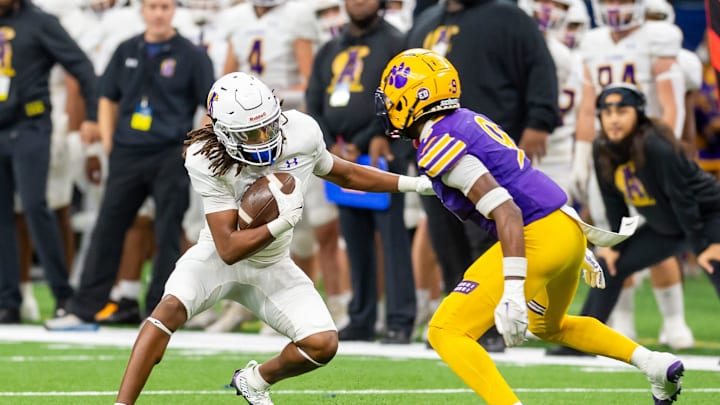 Edna Karr defender (right) tracks down an Alexandria player in the 2024 state championship game