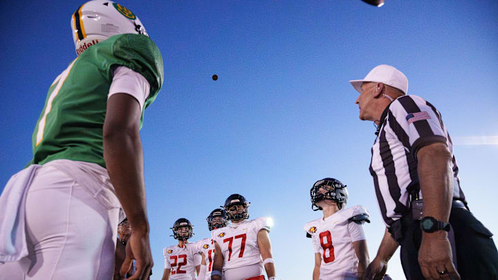 Chaparral and Saguaro captains come together for the coin toss before a Friday night football game at the Saguaro High School football field on Sept. 5, 2025, in Scottsdale.