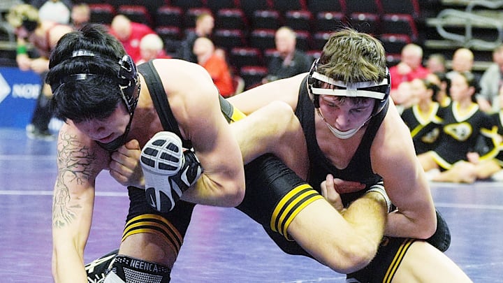 Southeast Polk’s Wil Oberbroeckling and Bettendorf’s Cody Trevino wrestle during their 138-pound wrestling 3A boys state Semi-final at Wells Fargo Arena on Friday, Feb. 21, 2025, in Des Moines, Iowa.