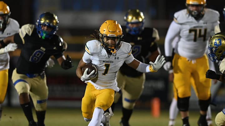 Bishop Manogue running back Amir McGruder runs the ball against Reed in Friday's game at Reed High School on Oct. 17, 2025. Bishop Manogue won 52-48.