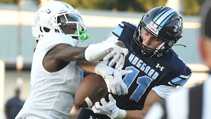 Hoggard's #11 Beau Toups comes up with a catch as Hoggard took on Cleveland at Hoggard High School's Scott Braswell Stadium in Wilmington, N.C. Varsity high school football games started Friday night Aug 18, 2023 around Southeastern North Carolina. Cleveland went on to defeat Hoggard 28-20. KEN BLEVINS/STARNEWS