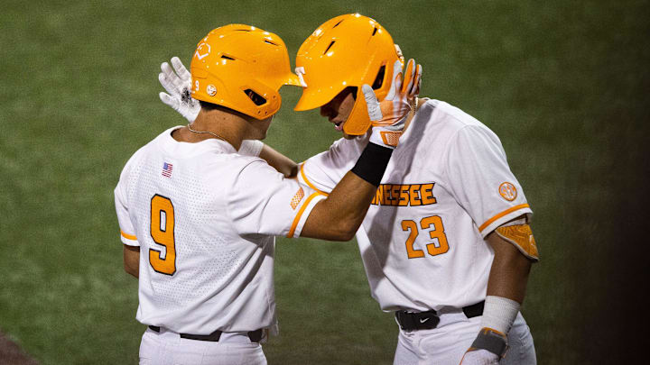 Tennessee's Hunter Ensley (9) and Tennessee's Dean Curley (23) celebrate Ensley's home run during a NCAA baseball tournament Knoxville Regional game between Tennessee and Northern Kentucky. 