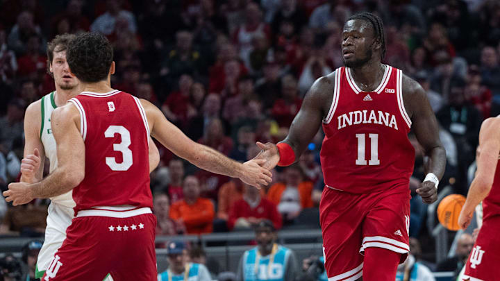 Indiana guard Anthony Leal (3) gives a high five to center Oumar Ballo (11) against Oregon during the Big Ten Tournament at Gainbridge Fieldhouse in Indianapolis.