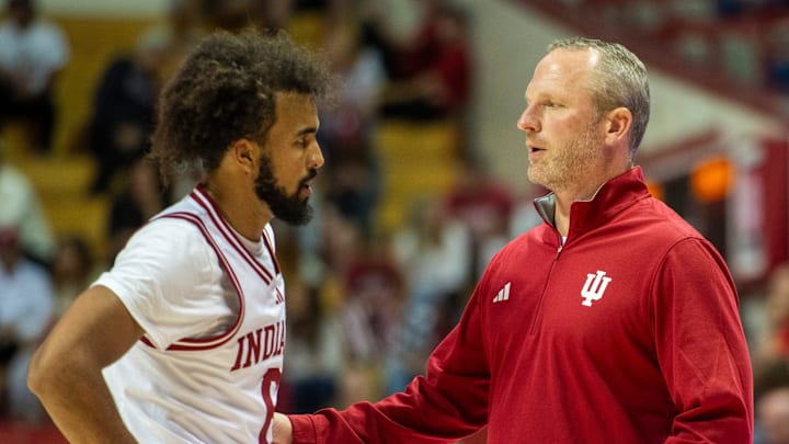 Indiana Head Coach Darian DeVries talks with Tayton Conerway (6) during the Indiana versus Marian men's basketball game at Simon Skjodt Assembly Hall on Friday, Oct.17, 2025. Indiana Head Coach Darian DeVries talks with Tayton Conerway (6) during the Indiana versus Marian men's basketball game at Simon Skjodt Assembly Hall on Friday, Oct.17, 2025.