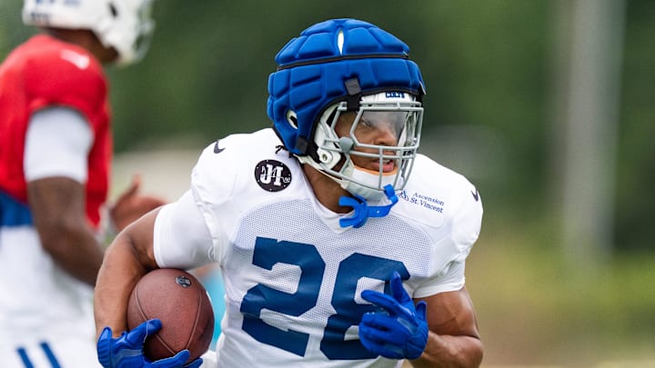 Indianapolis Colts running back Jonathan Taylor (28) takes off on a run Monday, July 28, 2025, during training camp held at Grand Park in Westfield. Indianapolis Colts running back Jonathan Taylor (28) takes off on a run Monday, July 28, 2025, during training camp held at Grand Park in Westfield.
