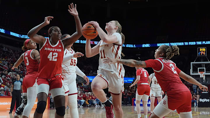 Iowa State Cyclones' guard Emily Ryan (11) shoots the ball over between Houston Cougars forward Peyton McFarland (42) and guard Kierra Merchant (2) during the fourth quarter in the Big-12 women’s basketball at Hilton Coliseum on Wednesday, Feb19, 2025, in Ames, Iowa.