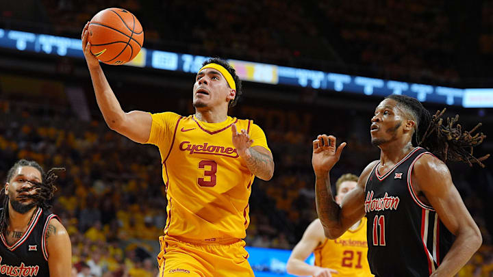 Iowa State Cyclones guard Tamin Lipsey (3) goes for a layup around Houston Cougars forward Joseph Tugler (11) during the first half in the3 Big-12 men’s basketball at Hilton Coliseum on Feb. 16, 2026, in Ames, Iowa