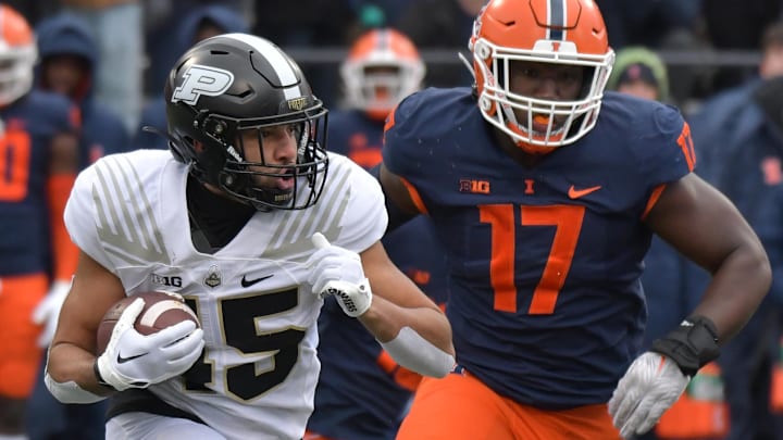 Nov 12, 2022; Champaign, Illinois, USA;  Purdue Boilermakers running back Devin Mockobee (45) runs with the ball as Illinois Fighting Illini linebacker Gabe Jacas (17) pursues during the first half at Memorial Stadium. Mandatory Credit: Ron Johnson-Imagn Images
